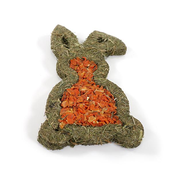 Hay-shaped carrot treat for pets on a white background