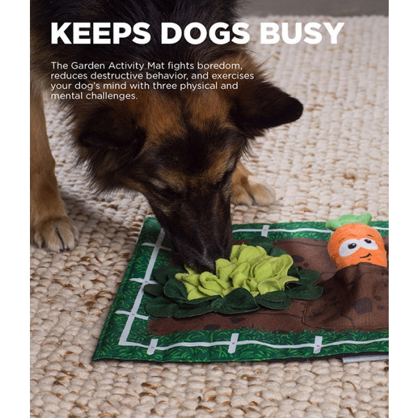Dog interacting with a Garden Activity Mat on a textured surface