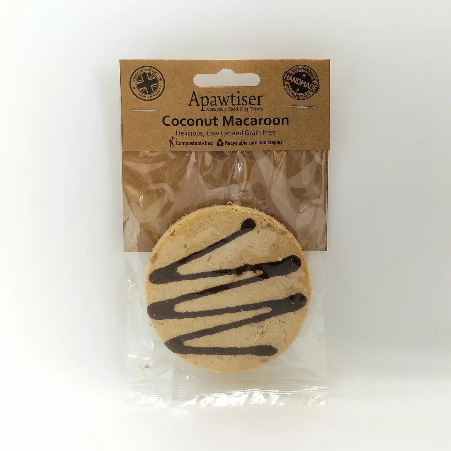 Dog enjoying a coconut macaroon dog treat made with apple, cinnamon and carob.