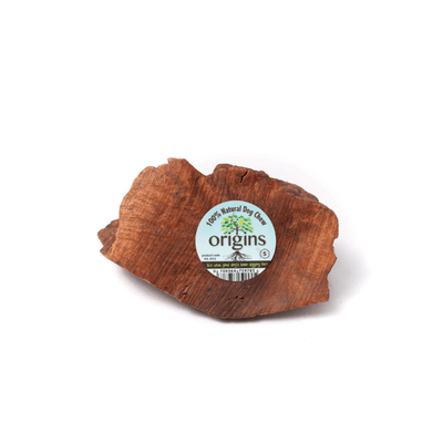 Several pieces of Origins briar root natural chew for dogs, presented on a white background.
