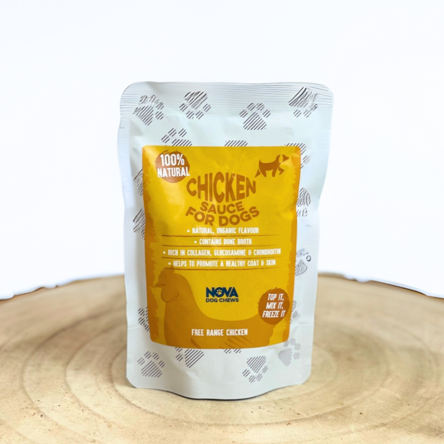 Nova Chicken Sauce for Dogs on a wooden tray against a white background