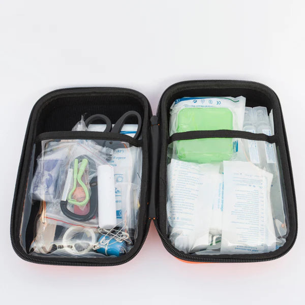 Fully opened DogsLife pet first aid kit showing organised compartments filled with essential emergency items for dogs and cats, including bandages, scissors, tick removers, antiseptic wipes, tape, and dressings – ideal for pet travel, outdoor adventures, and everyday safety