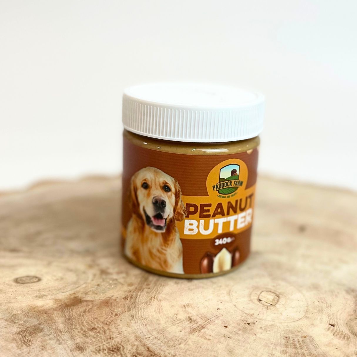 340g jar of Paddock Farm peanut butter for dogs, natural and xylitol-free treat ideal for enrichment toys and licking mats, available at Amyβs Pet Supplies.