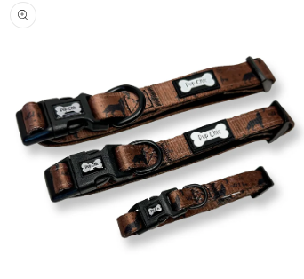 Three brown dog collars with black accents on a white background