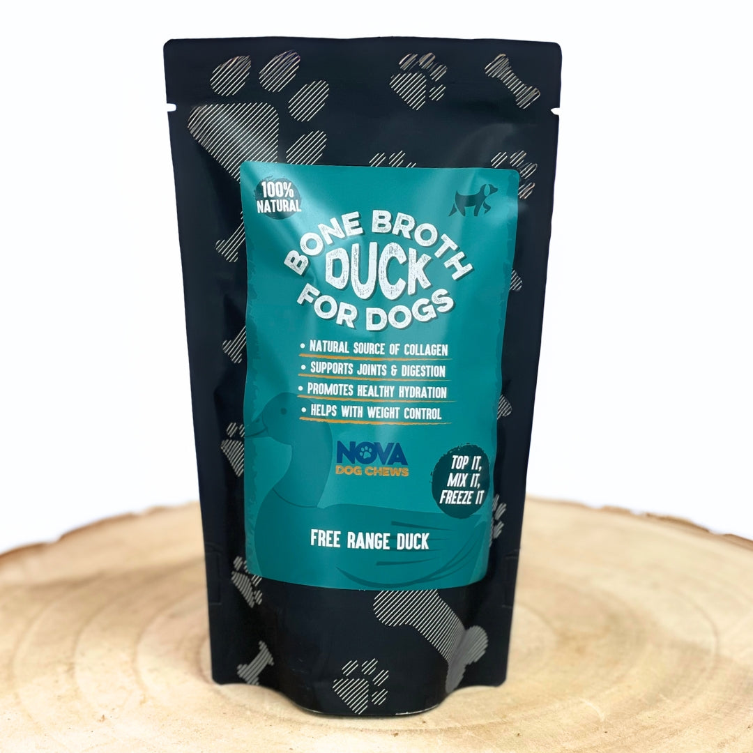 Package of 'Bone Broth Duck for Dogs' on a wooden surface