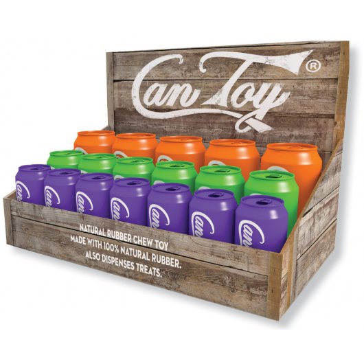 A display of soda can-shaped rubber dog enrichment toys in various sizes, with colors including purple, green, orange, and red, arranged in a wooden box.
