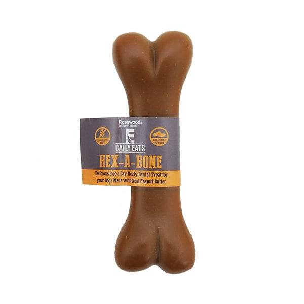 A bone-shaped dog treat with a label indicating it is grain and gluten-free, made with peanut butter.