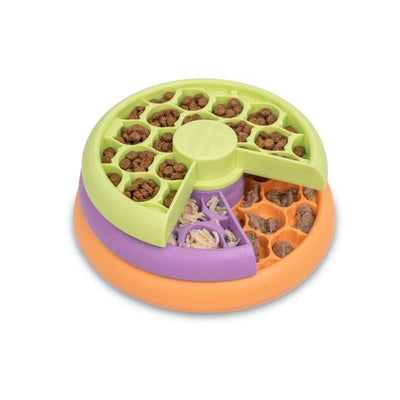 Colorful pet toy with food compartments on a white background