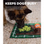 Dog interacting with a Garden Activity Mat on a textured surface