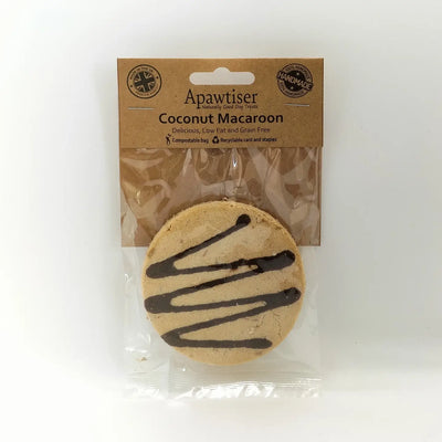 Dog enjoying a coconut macaroon dog treat made with apple, cinnamon and carob.

