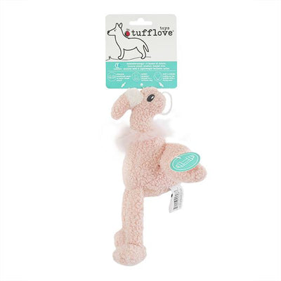 Pink plush dog toy with packaging on a white background