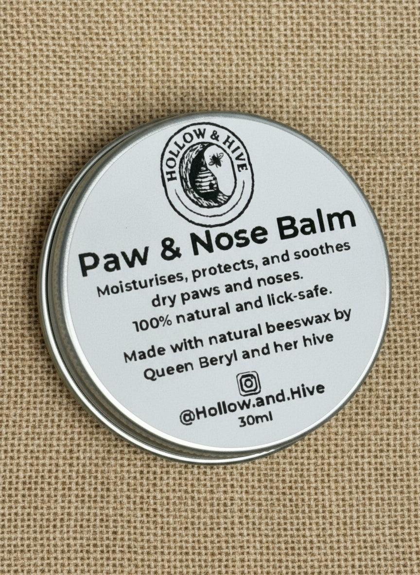 Paw and Nose Balm container with label on a beige background