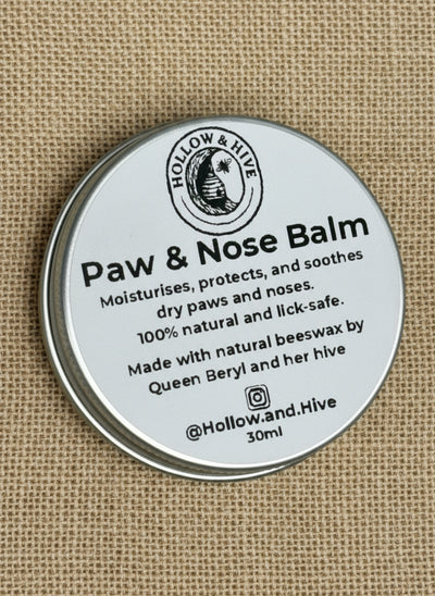 Paw and Nose Balm container with label on a beige background
