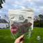 Paddock Farm Venison Strips natural dog treats held outside, resealable bag of high-protein grain-free venison chews for dogs, made with 100% meat, available at Amy’s Pet Supplies.