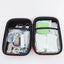 Fully opened DogsLife pet first aid kit showing organised compartments filled with essential emergency items for dogs and cats, including bandages, scissors, tick removers, antiseptic wipes, tape, and dressings – ideal for pet travel, outdoor adventures, and everyday safety
