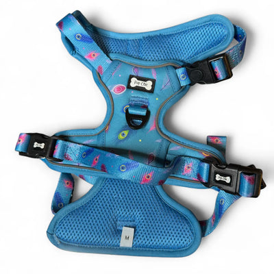Step-in tactical dog harness with teal peacock feather design – flat lay