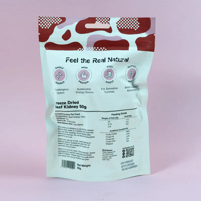 Package of freeze-dried pet food with red and white design on a pink background