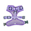 Purple dog harness with cartoon designs on a light purple background