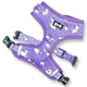 Purple dog harness with unicorn pattern on a white background