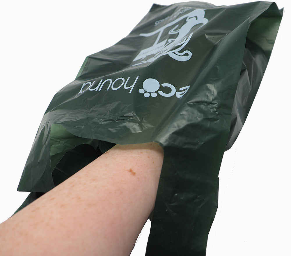 Ecohound biodegradable poo bag on hand, showing large size and thickness for secure dog waste pickup