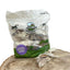 200g bag of Paddock Farm hairy rabbit ears natural dog treats on wooden surface, showing resealable eco-friendly packaging with dried chews displayed in front