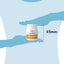 Bottle of turmeric supplement with a measurement of 65mm against a blue background