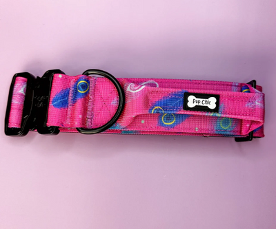 Pink dog collar with colorful patterns on a pink background