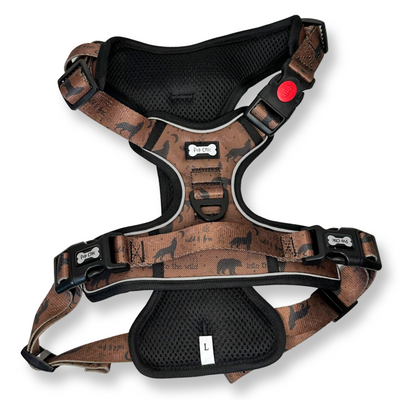 Dog harness with brown pattern and black accents on a white background
