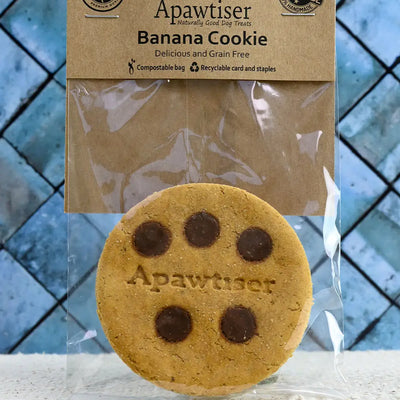 Handmade banana dog cookie topped with xylitol-free carob drops.

