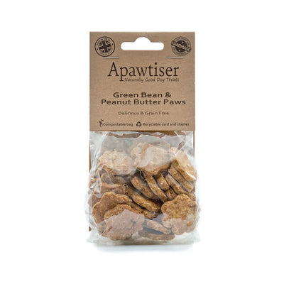 Green bean and peanut butter crunchy dog biscuits in a fun paw shape.

