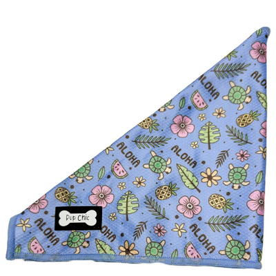 Pup Chic Boutique Cooling bandana in the pattern Island Breeze, a Hawaiian inspire blue, pink and green design, pictured on a white background. 