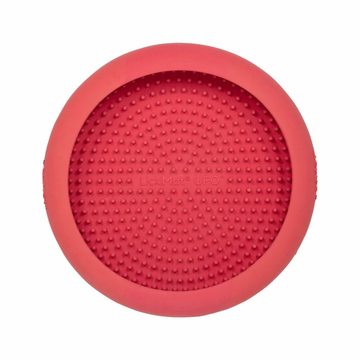 Pink LickiMat UFO dog lick bowl with a raised rim and textured feeding surface