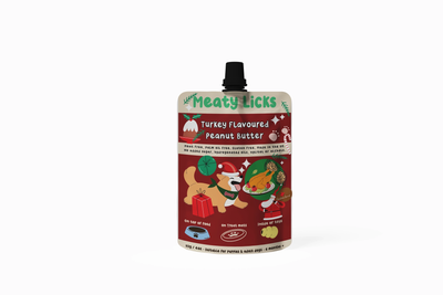 Meaty Licks Turkey Flavoured Peanut Butter for Dogs 113g pouch with a black screw cap and red Christmas label