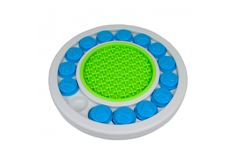 Örva Puzzle Ring dog toy with blue puzzle covers and a green central lick mat
