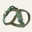 Twiggy Tags Apex Nomad dog harness with green contour-pattern straps, olive padding, reflective trim, clip buckles and a padded back handle.