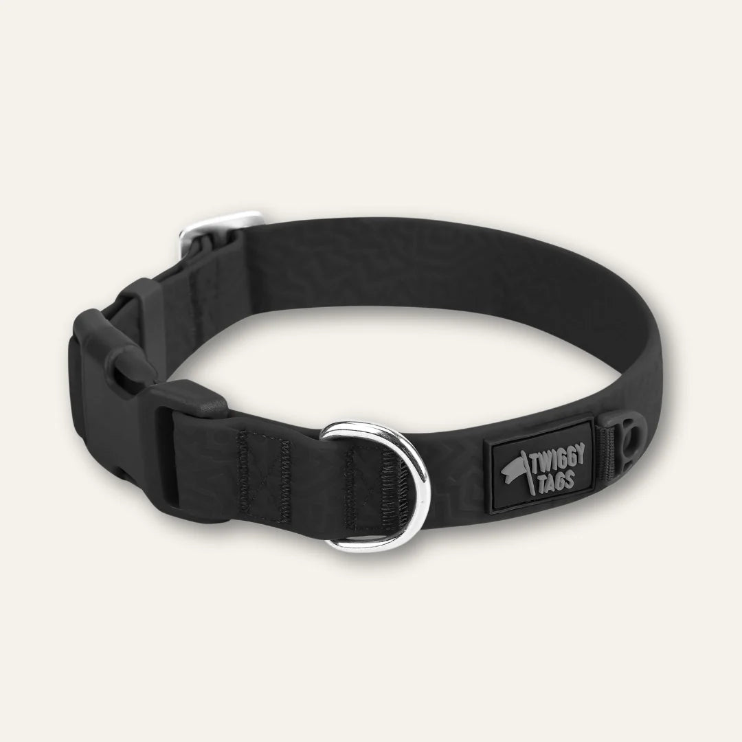 Twiggy Tags Tidal Waterproof Collar in Midnight black with an embossed surface, adjustable clip buckle, silver D-ring and Twiggy Tags logo.