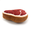 Side view of Whiff Woofs Steak scented dog toy showing thick brown plush sides and smiling red steak design