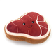 Whiff Woofs steak shaped plush dog toy with red top, cream detailing and smiling face