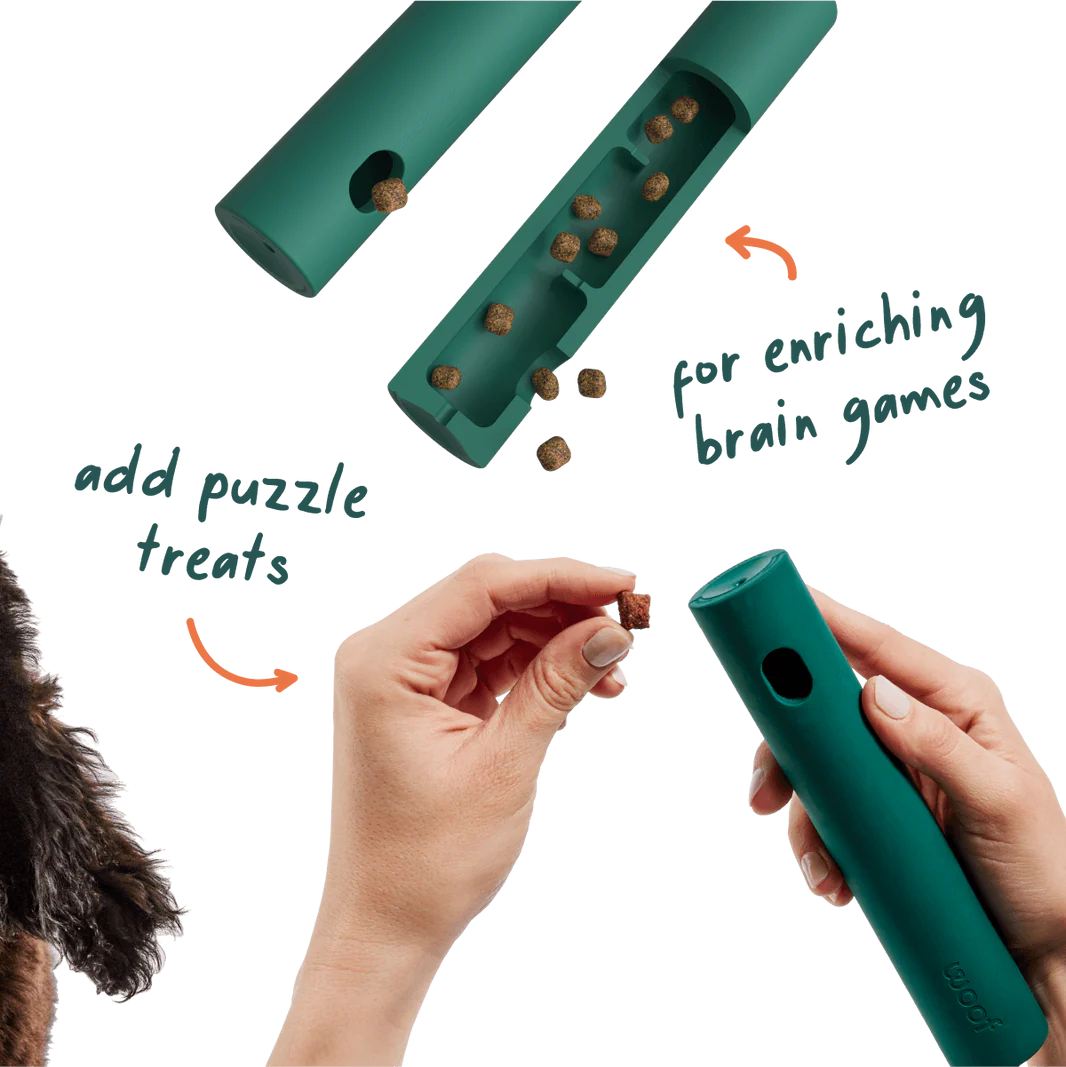 Woof Nomchucks dog enrichment toy cutaway showing hidden treat chambers and treats being added