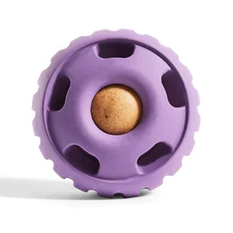 Lavender Woof Pupsicle licking toy shown with a treat inside