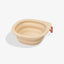 Zee.Dog GoBowl in Biscotti beige shown expanded with an orange carabiner